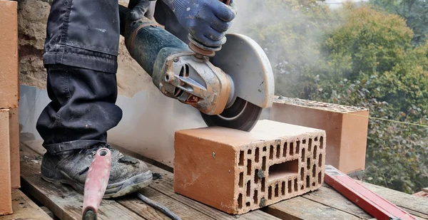 Someone utilizing a power saw.